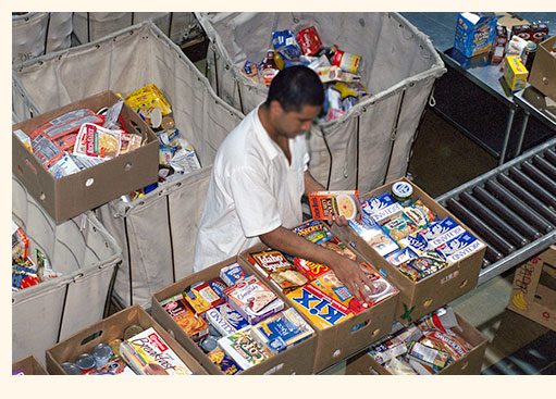 Offender packing mutritious meals for underprivileged school children