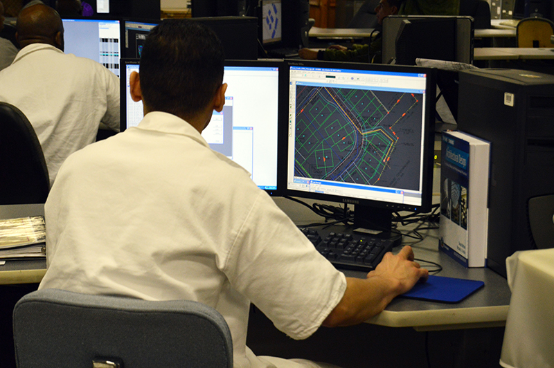 Photo of offender at a CAD (Computer Aided Drafting) computer