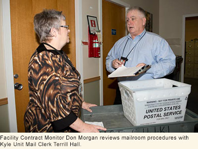 Photo of Kilpatrick and Faries receiving award from CID Director Bill Stephens