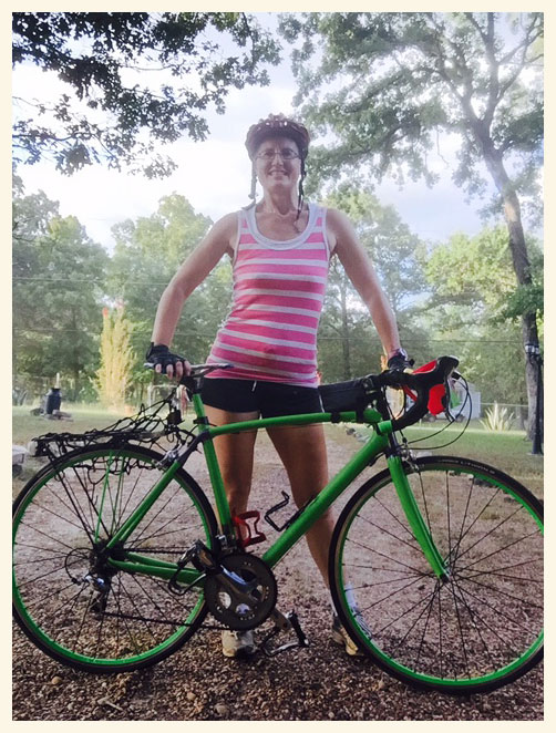 Photo today of Christy Hoisington and her bicycle